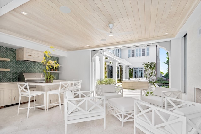 sunroom with wooden ceiling