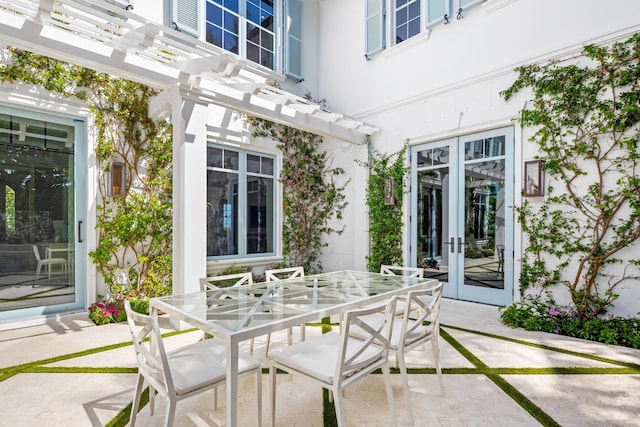 view of patio featuring french doors and a pergola