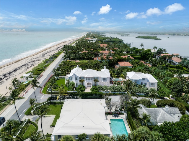 aerial view with a water view and a view of the beach