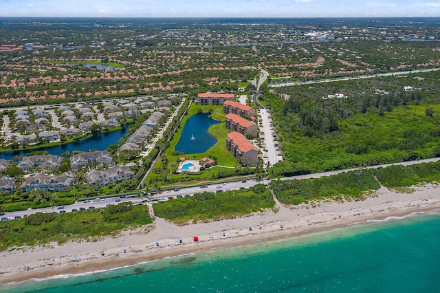 drone / aerial view with a water view and a view of the beach