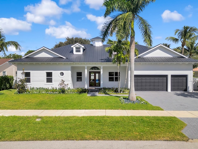 view of front facade with a front lawn and a garage