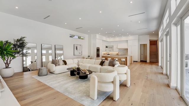 living room with light hardwood / wood-style flooring