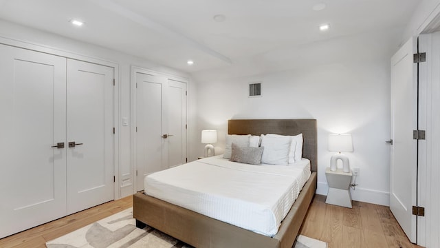 bedroom with light hardwood / wood-style floors