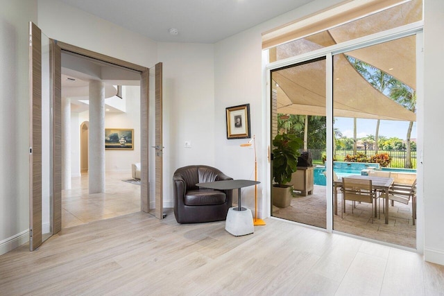 sitting room with light hardwood / wood-style floors