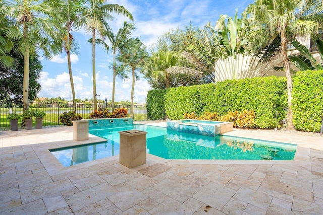 view of pool featuring an in ground hot tub and a patio area