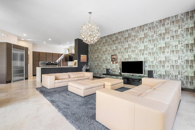 living room with a textured ceiling and an inviting chandelier