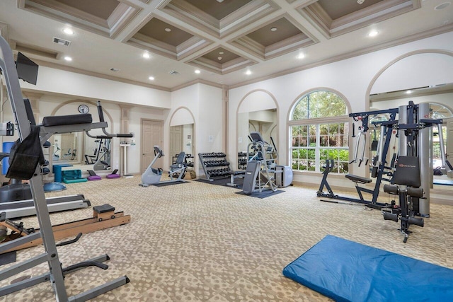 exercise room with crown molding, coffered ceiling, and carpet