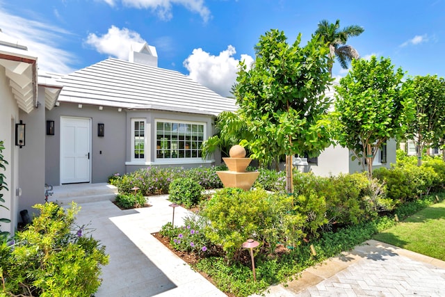 284 Monterey Rd, Palm Beach, FL 33480 - view of front of property featuring stucco siding and a chimney