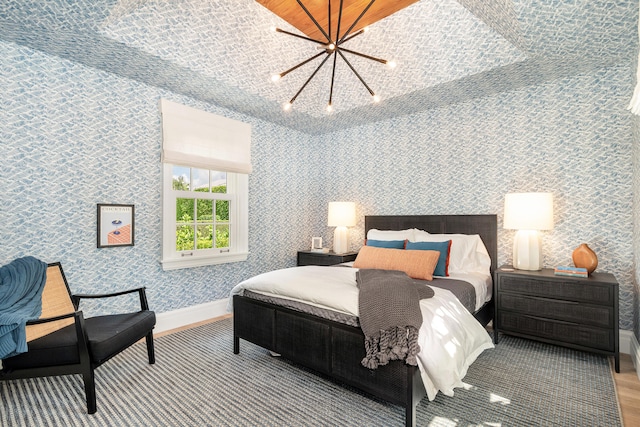 bedroom featuring a notable chandelier