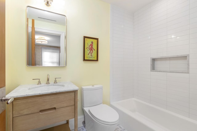 full bathroom featuring vanity, toilet, and tiled shower / bath combo