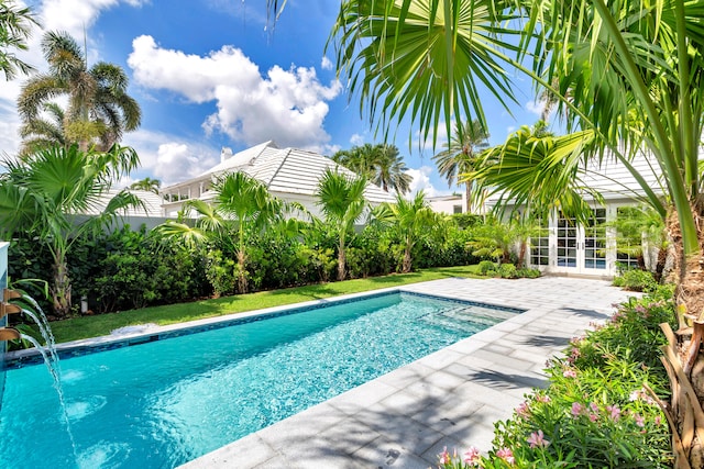 view of pool featuring a patio area and pool water feature