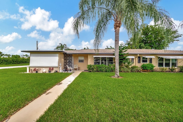 single story home with a front yard