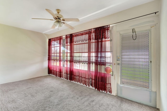 empty room with carpet floors and ceiling fan