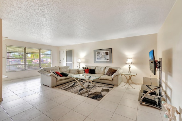 tiled living room featuring a textured ceiling