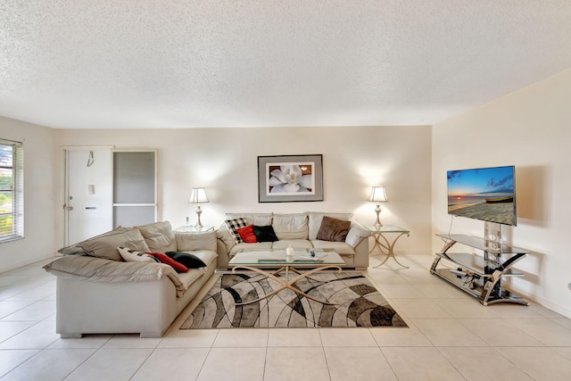 living room with light tile patterned floors and a textured ceiling