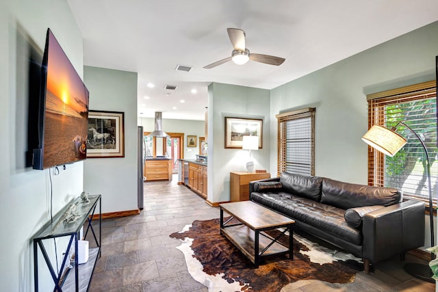 living room featuring ceiling fan