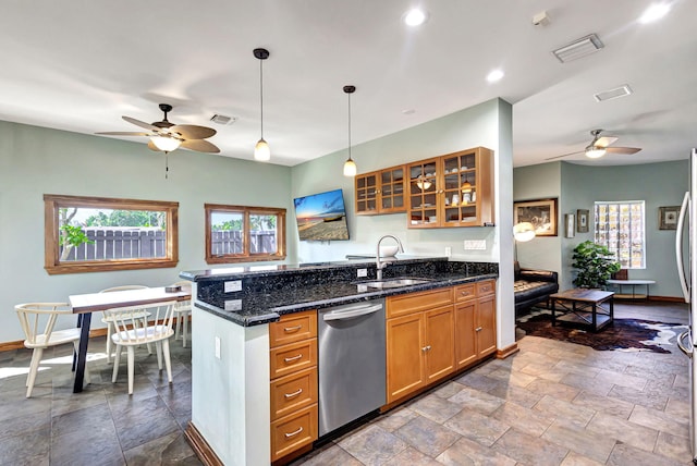 kitchen with a wealth of natural light, sink, dishwasher, and hanging light fixtures