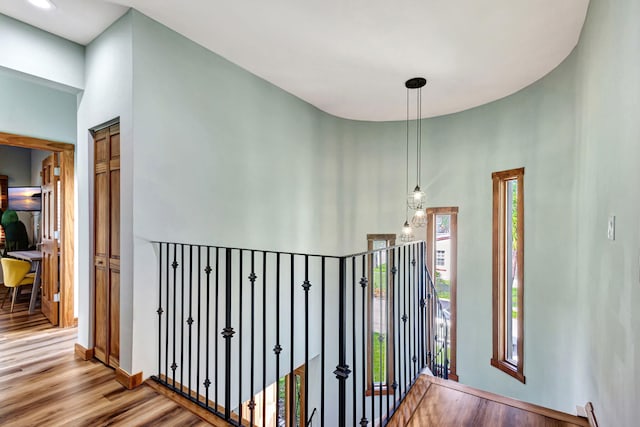 hallway with light hardwood / wood-style floors