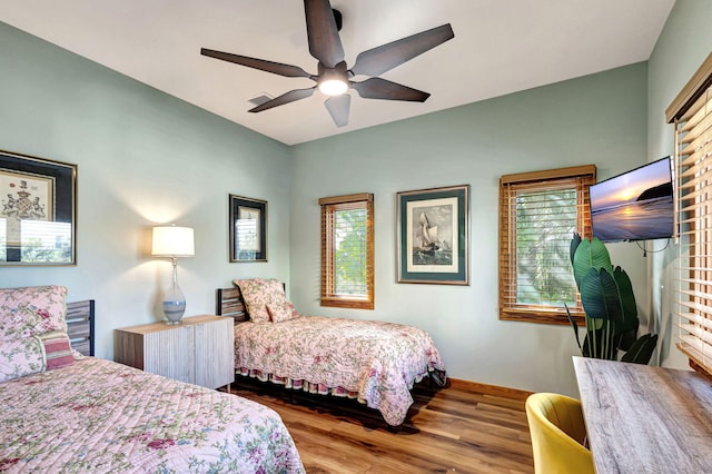 bedroom featuring wood-type flooring and ceiling fan