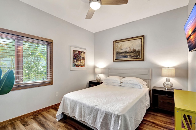 bedroom with hardwood / wood-style flooring and ceiling fan