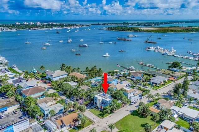 birds eye view of property with a water view