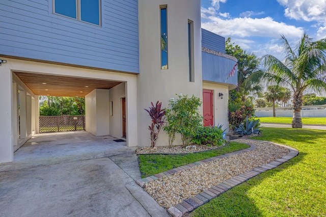 view of side of property with a yard