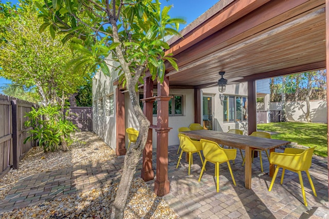 view of patio / terrace featuring ceiling fan