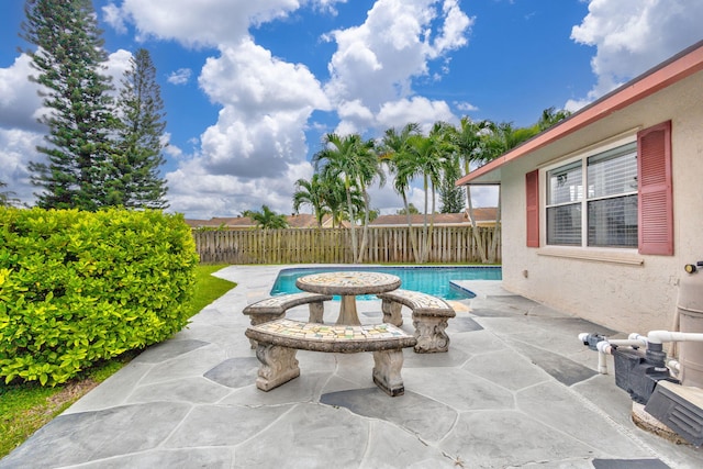 view of swimming pool with a patio