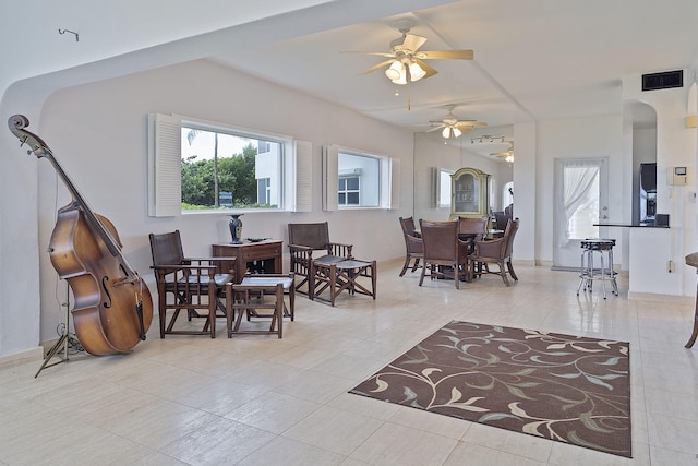 interior space featuring ceiling fan, plenty of natural light, and light tile patterned floors