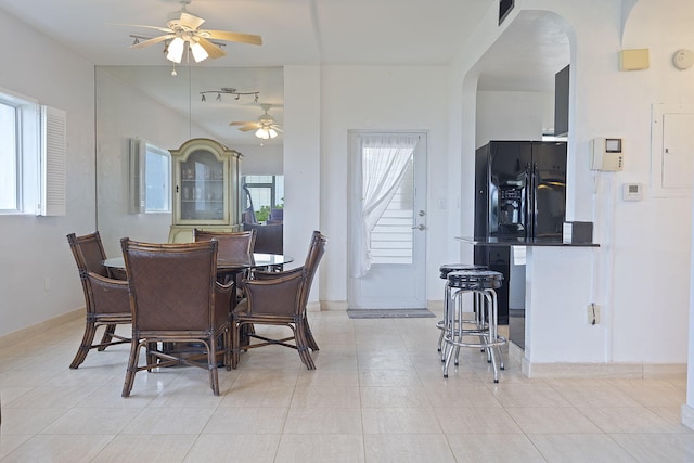 dining area with ceiling fan and light tile patterned floors