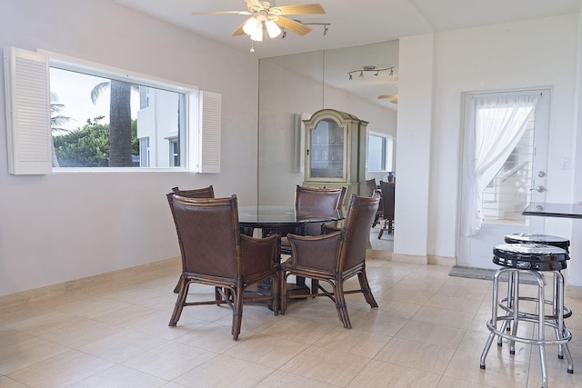 dining space featuring a wealth of natural light, ceiling fan, and light tile patterned floors