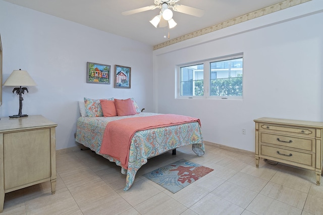 bedroom with ceiling fan and light tile patterned floors