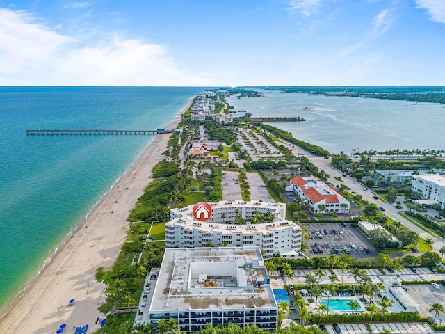 bird's eye view with a water view and a view of the beach