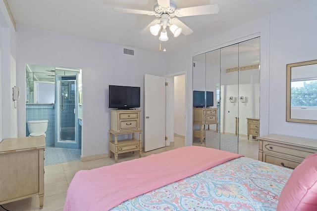 bedroom with light tile patterned floors, a closet, and ceiling fan