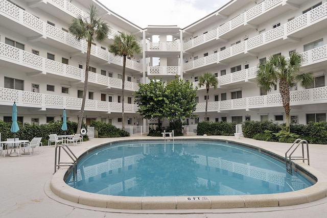 view of swimming pool with a patio area