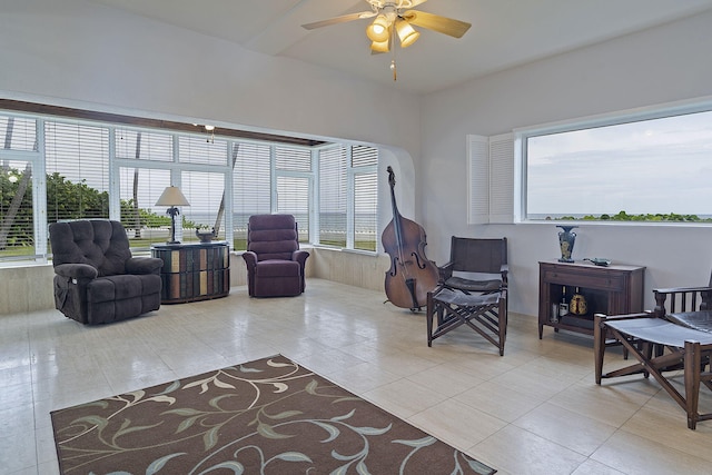 tiled living room featuring ceiling fan