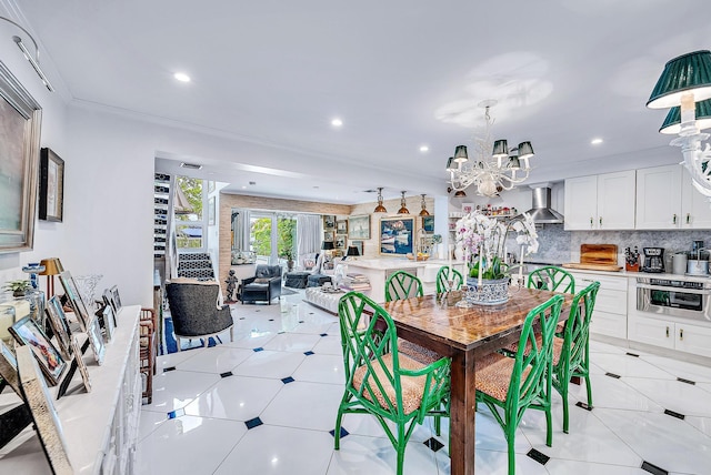 dining area featuring crown molding, light tile patterned flooring, and an inviting chandelier