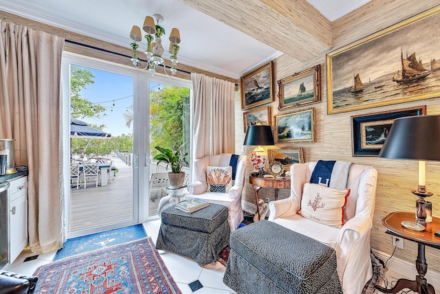 living area featuring ornamental molding and a chandelier