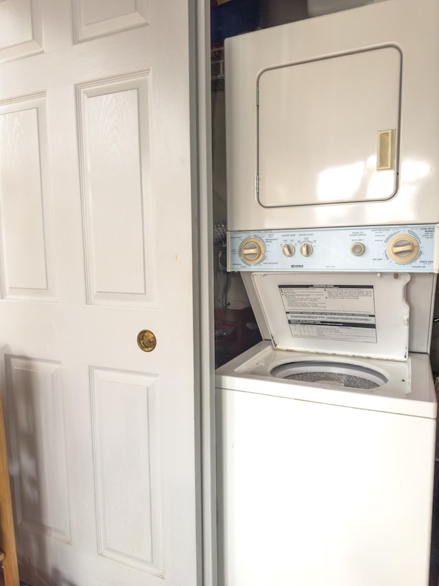 laundry room featuring stacked washer / dryer