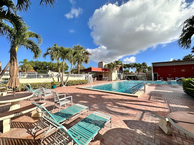 view of swimming pool featuring a patio