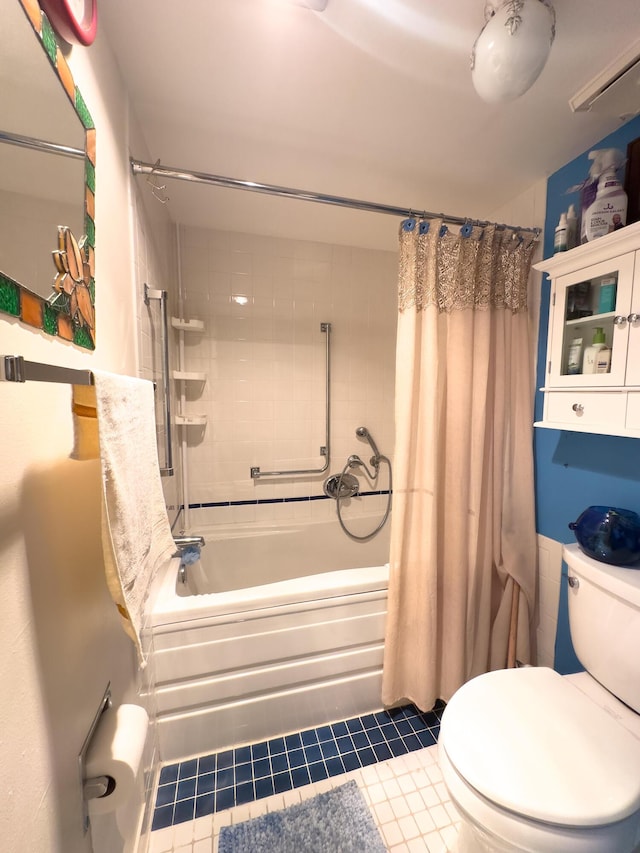 bathroom featuring toilet, shower / bath combination with curtain, and tile patterned flooring