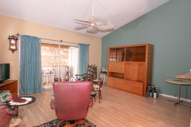 office space with ceiling fan, light hardwood / wood-style floors, and lofted ceiling