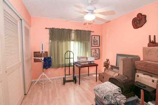 interior space with light hardwood / wood-style floors and ceiling fan