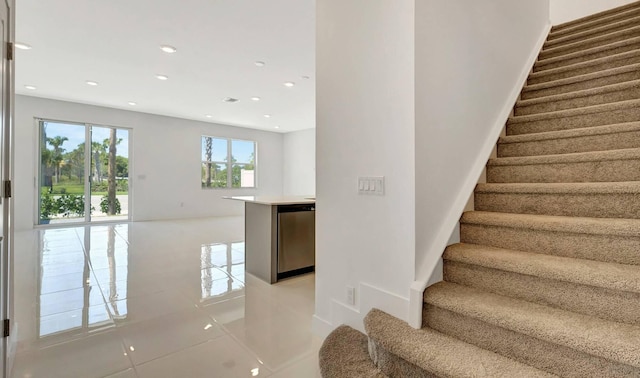 stairway featuring tile patterned floors