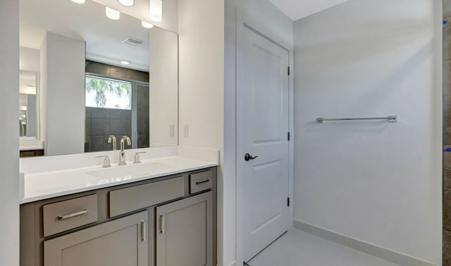 bathroom featuring vanity and a shower