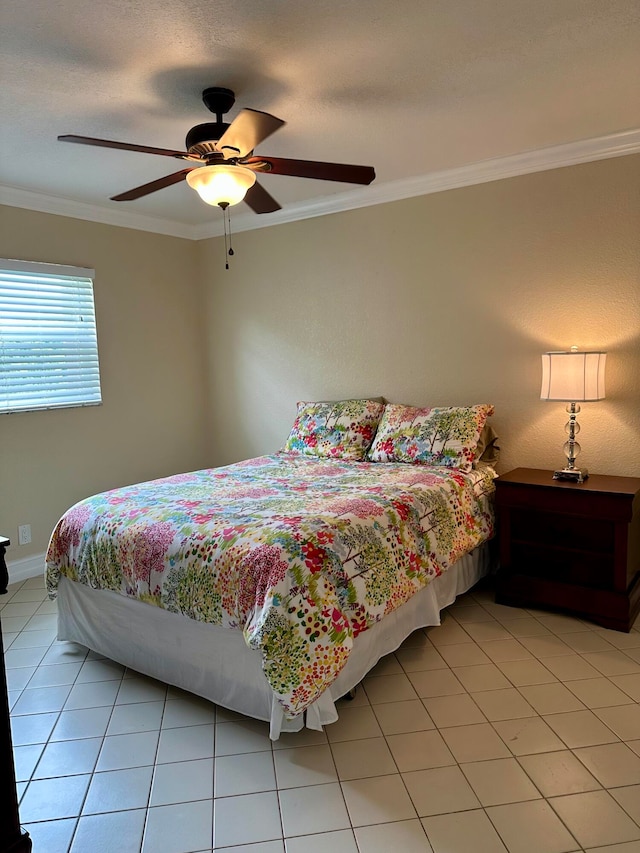 tiled bedroom with crown molding and ceiling fan