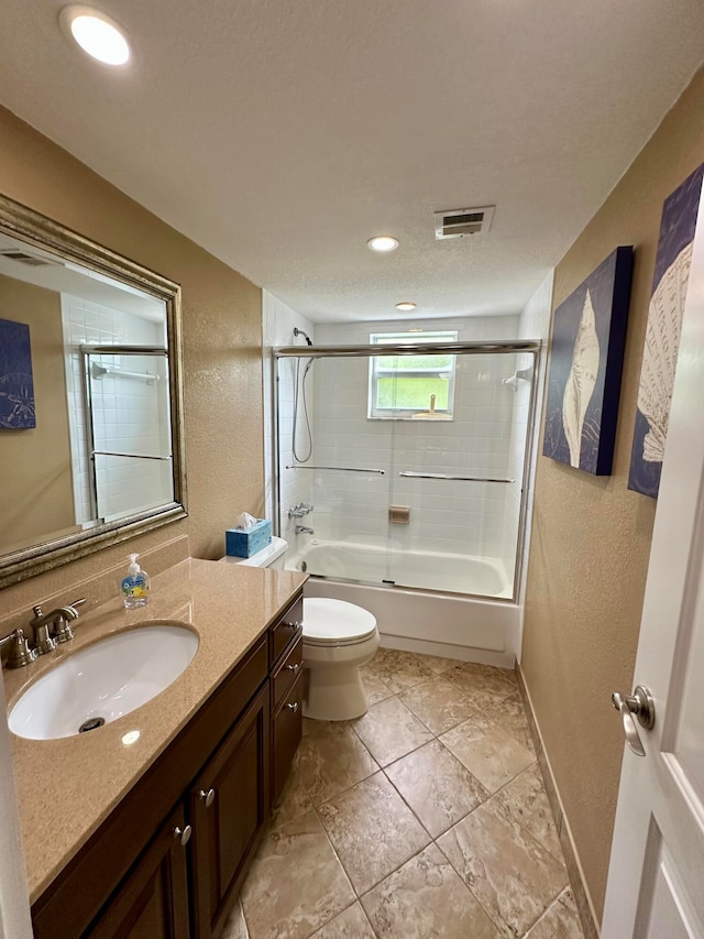 full bathroom with toilet, enclosed tub / shower combo, and vanity