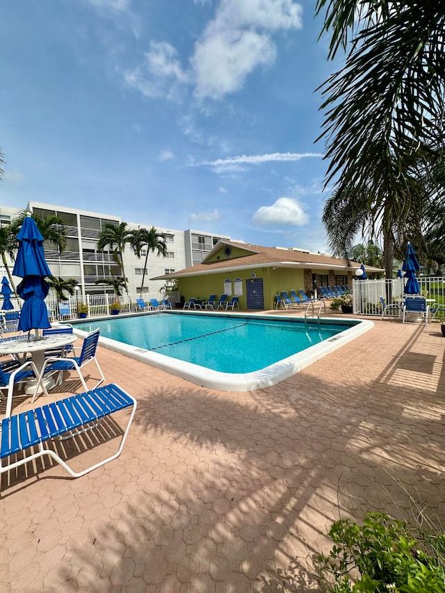 view of swimming pool with a patio area