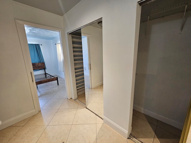 hallway with light tile patterned flooring