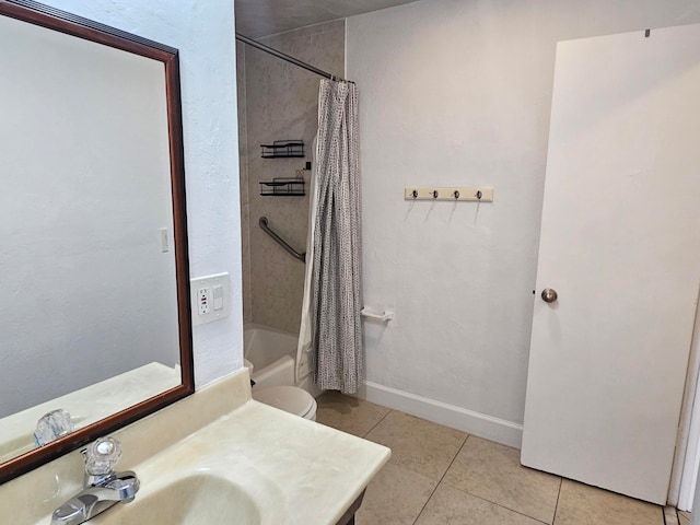 full bathroom with tile patterned floors, vanity, toilet, and shower / bath combo with shower curtain